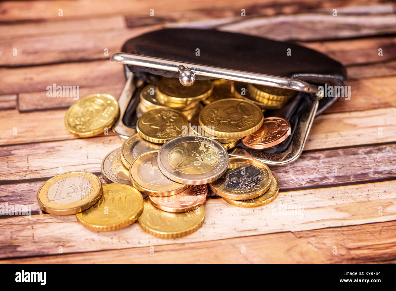 Open wallet with many euro coins Stock Photo Alamy