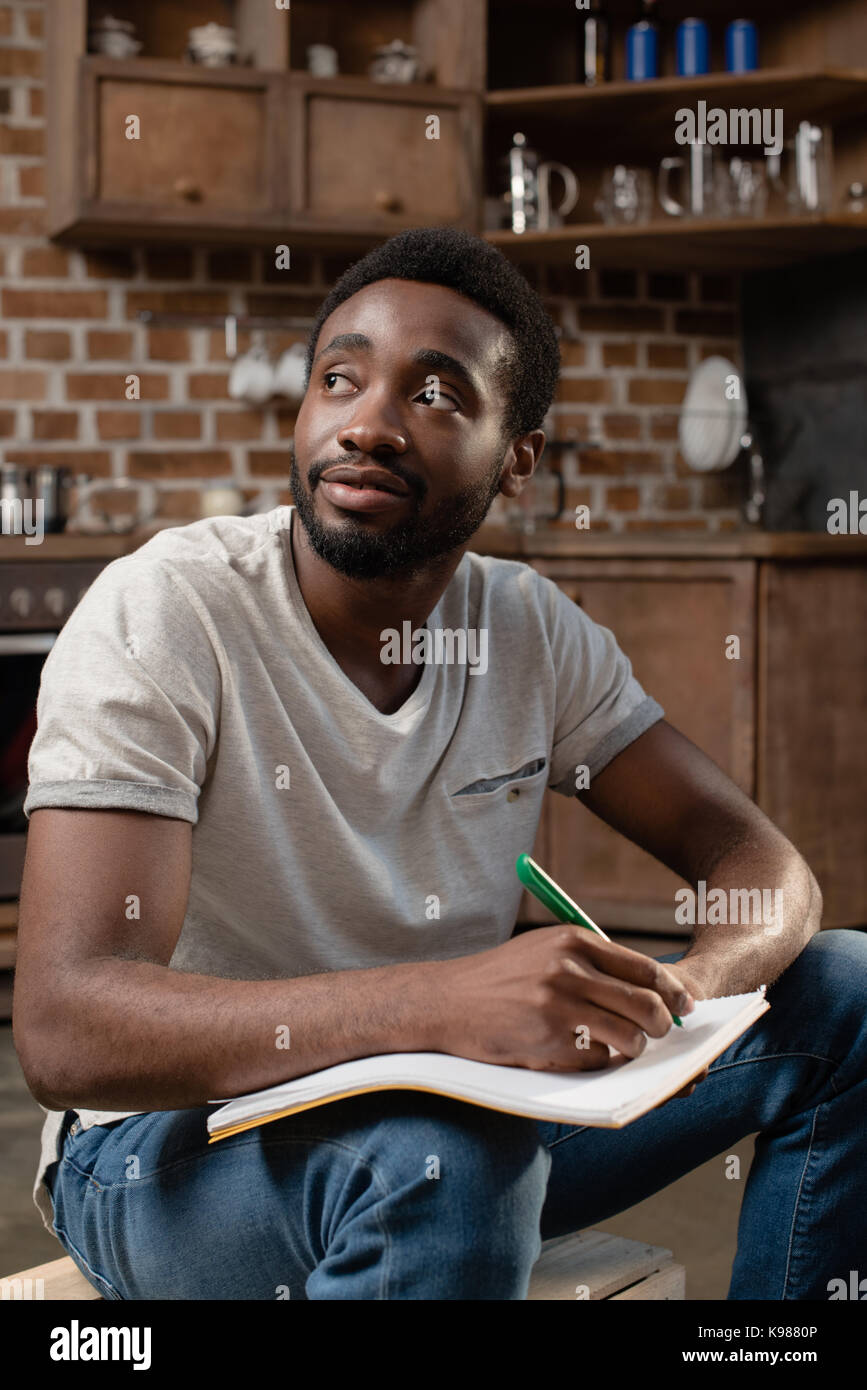 student writing in copybook Stock Photo - Alamy