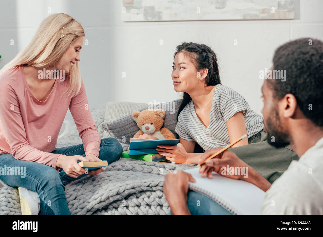 young students doing homework together Stock Photo