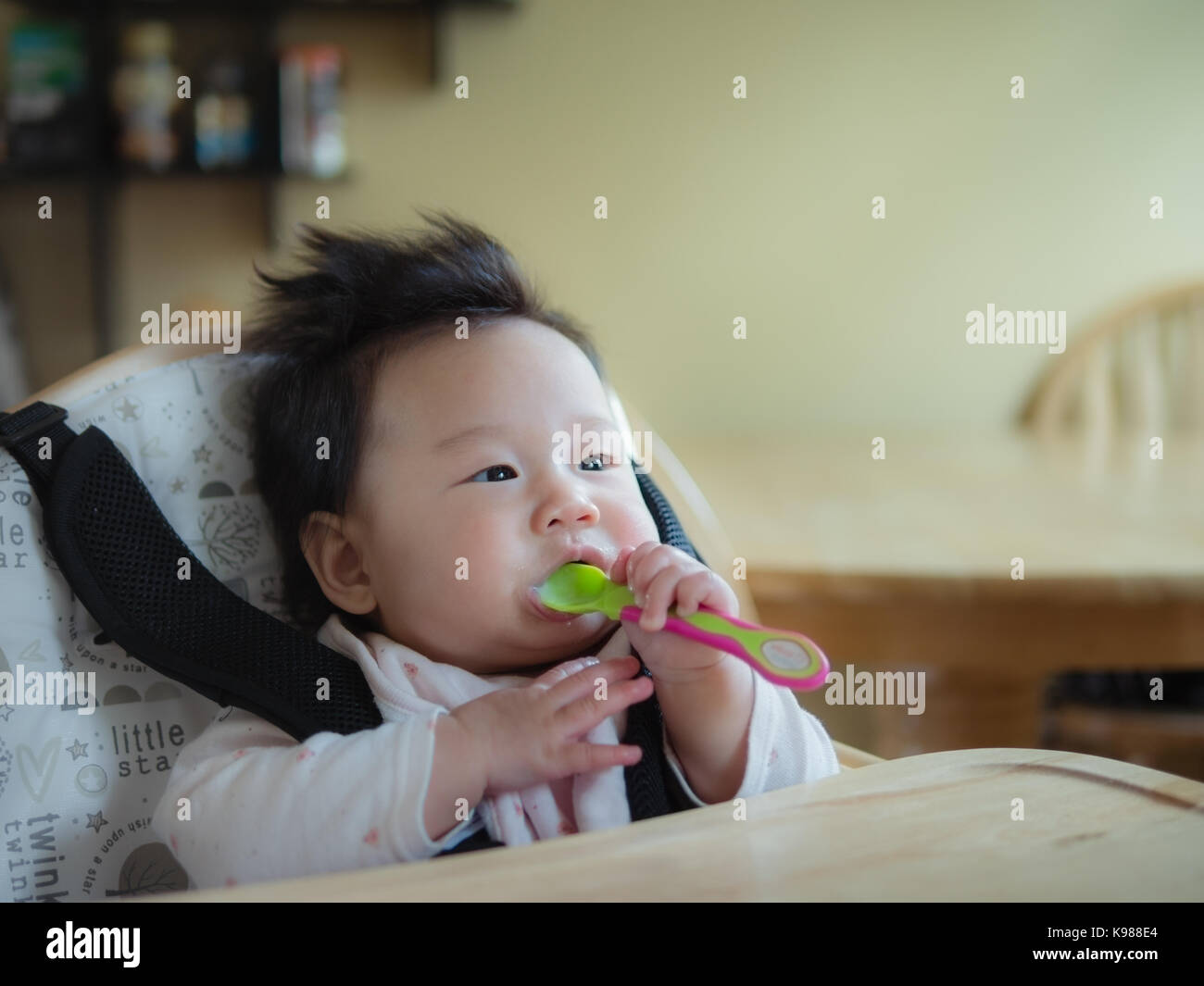 baby girl weaning first time Stock Photo