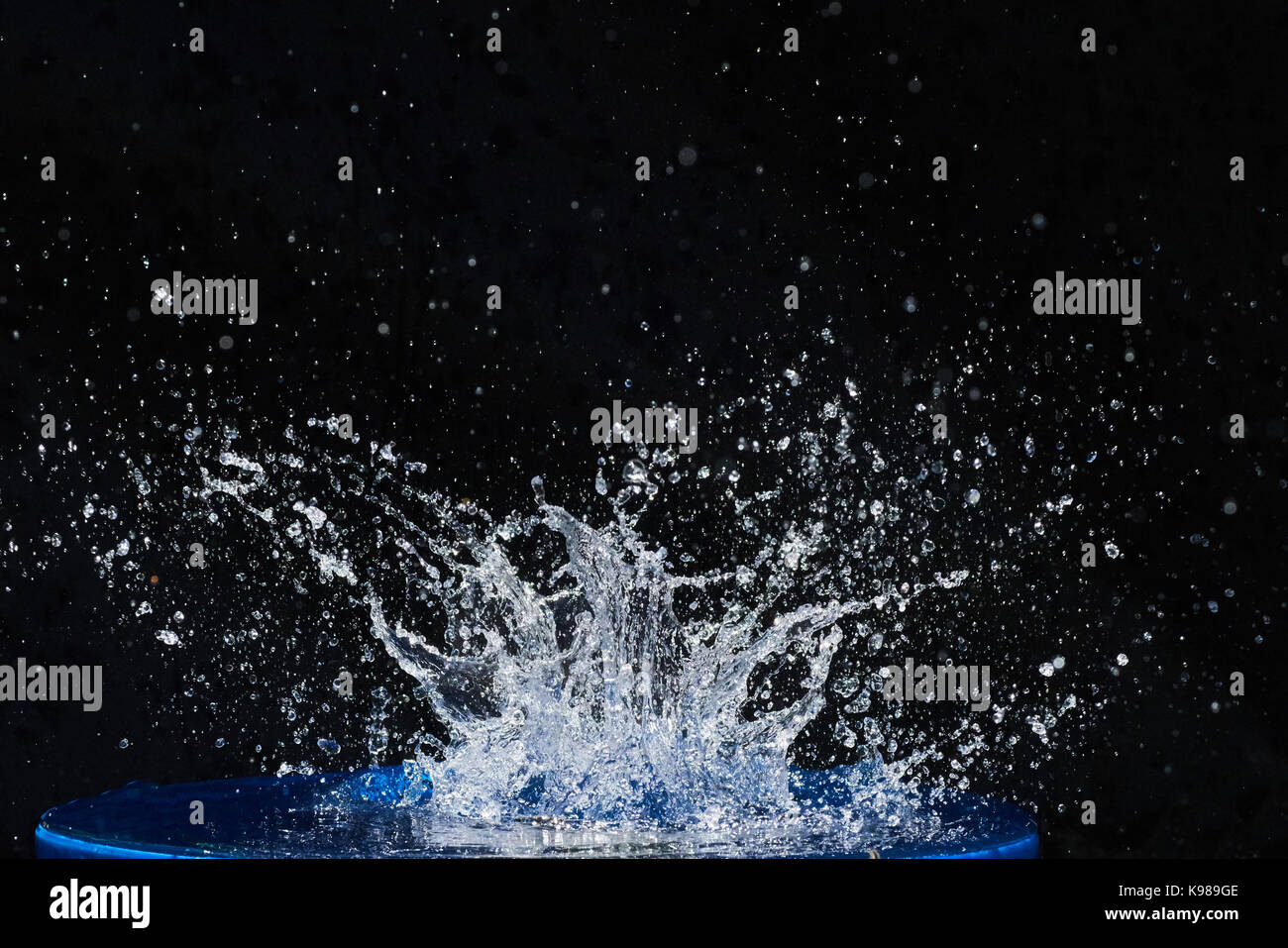 Beautiful blue water drops falling down Stock Photo - Alamy