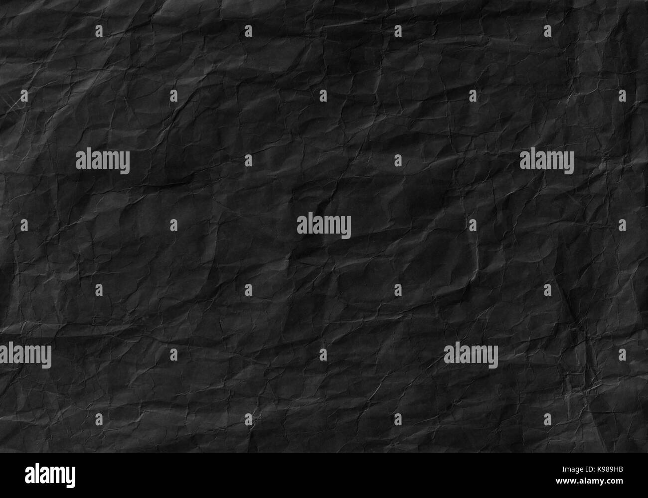 Black crumpled paper texture. Background and wallpaper Stock Photo - Alamy