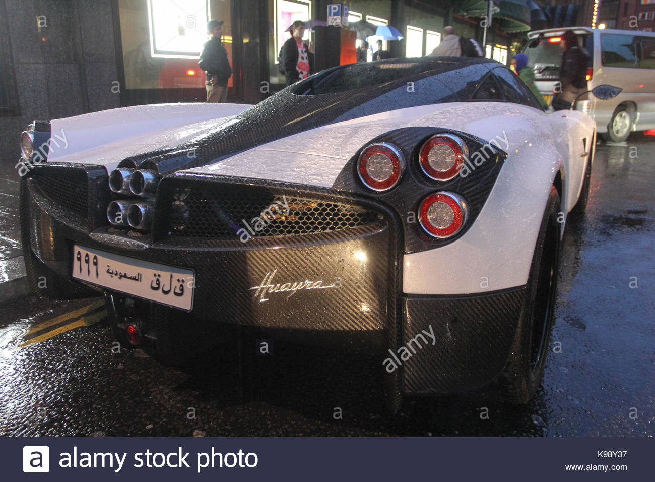 Pagani Huayra. Super cars seen parked in rainy day all over Central ... Pagani Huayra. Super cars seen parked in rainy day all over Central ...
