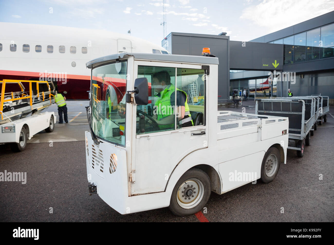 Worker Driving Vehicle On Runway Stock Photo