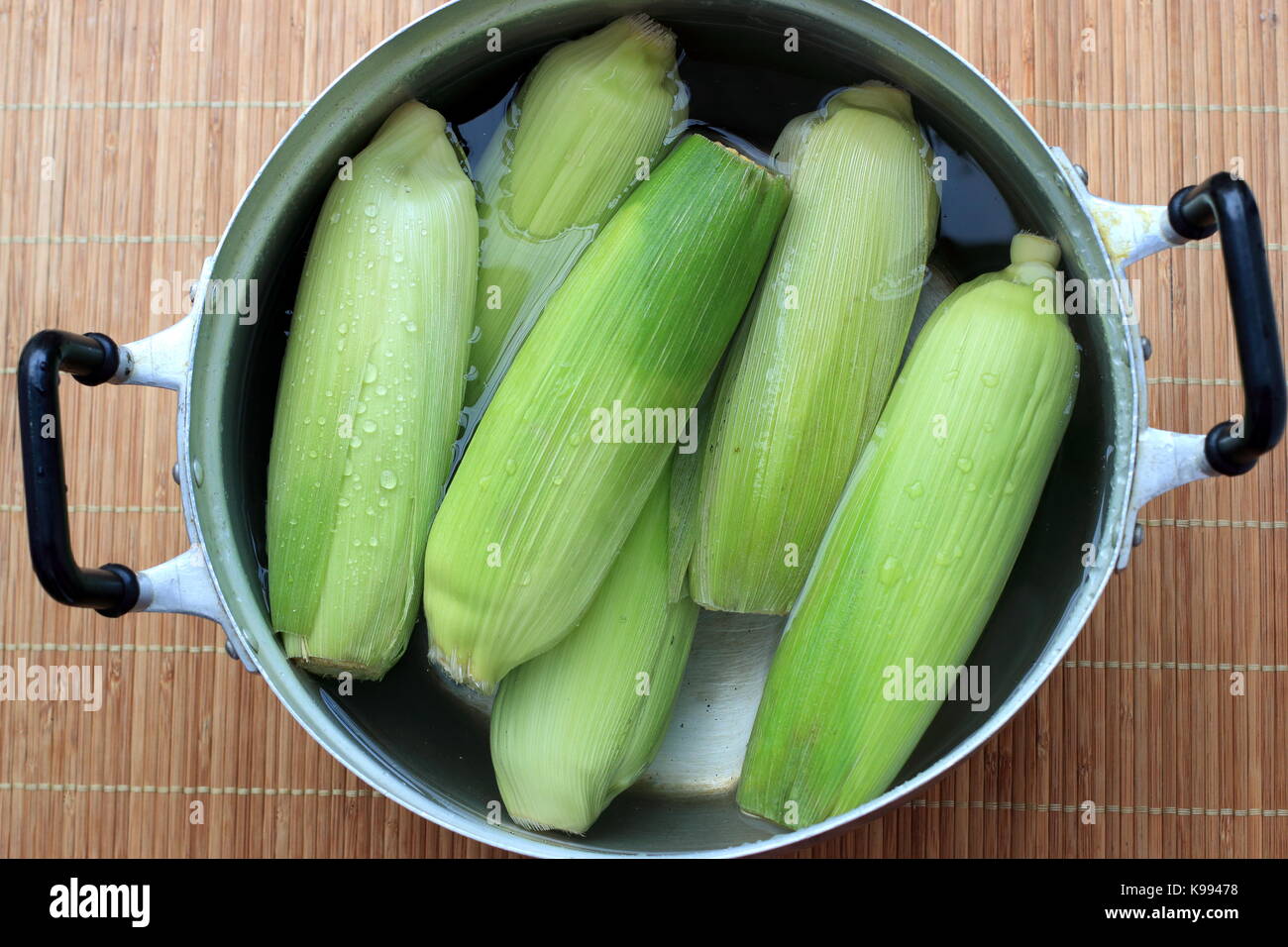 Corn in a pot ready for boiling Stock Photo