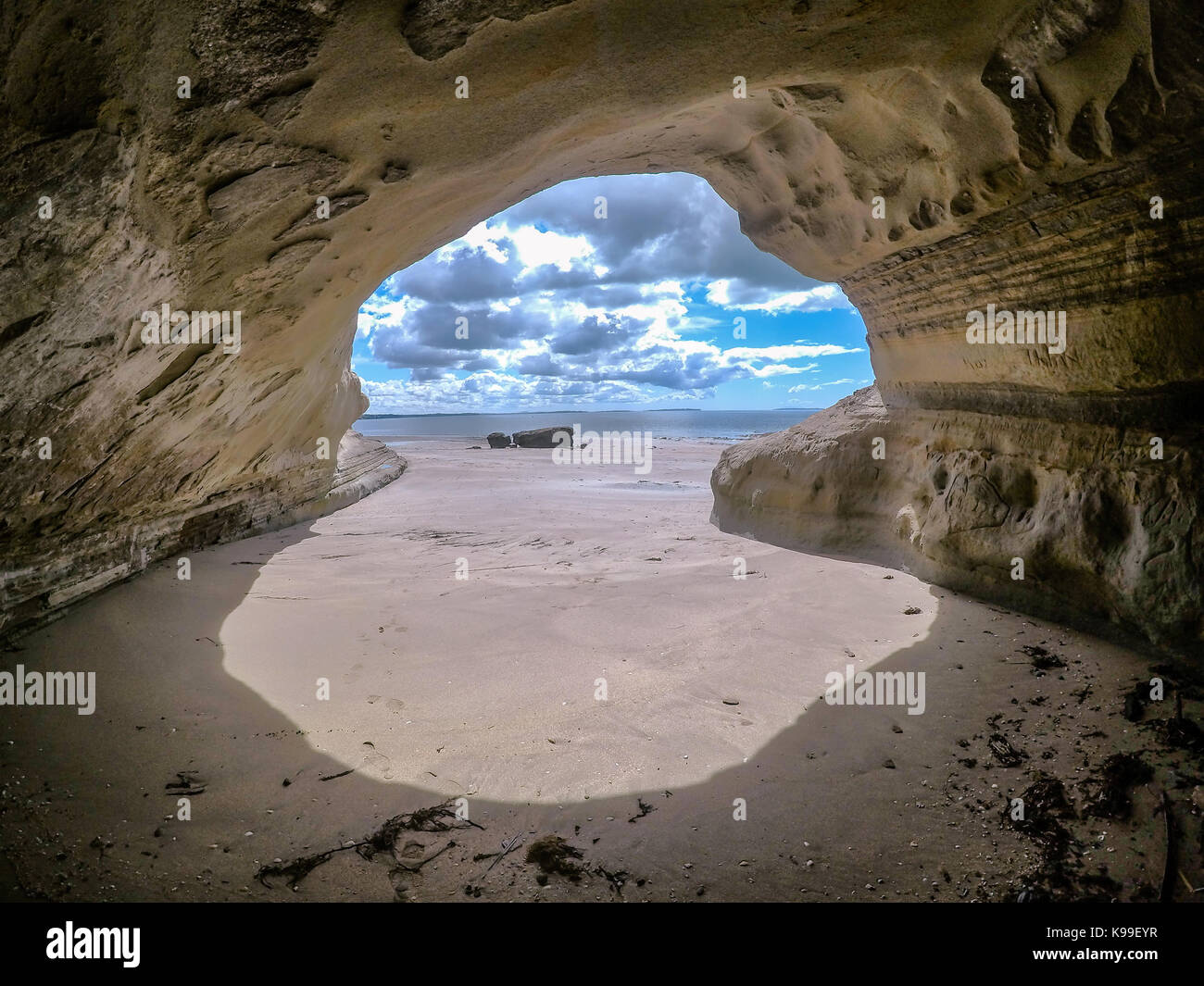 Looking out through cave to sea near Takapuna Beach, North Shore, Auckland, New Zealand, NZ Stock Photo