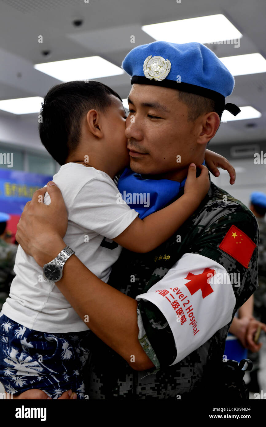 Zhengzhou, China's Henan Province. 21st Sep, 2017. Han Dajin, a Chinese peacekeeper, bids farewell to his three-year-old son before leaving for South Sudan from Zhengzhou, capital of central China's Henan Province, Sept. 21, 2017. The 105-member squad of Chinese peacekeepers left for Wau in South Sudan on a one-year peacekeeping mission. Credit: Zhu Xiang/Xinhua/Alamy Live News Stock Photo
