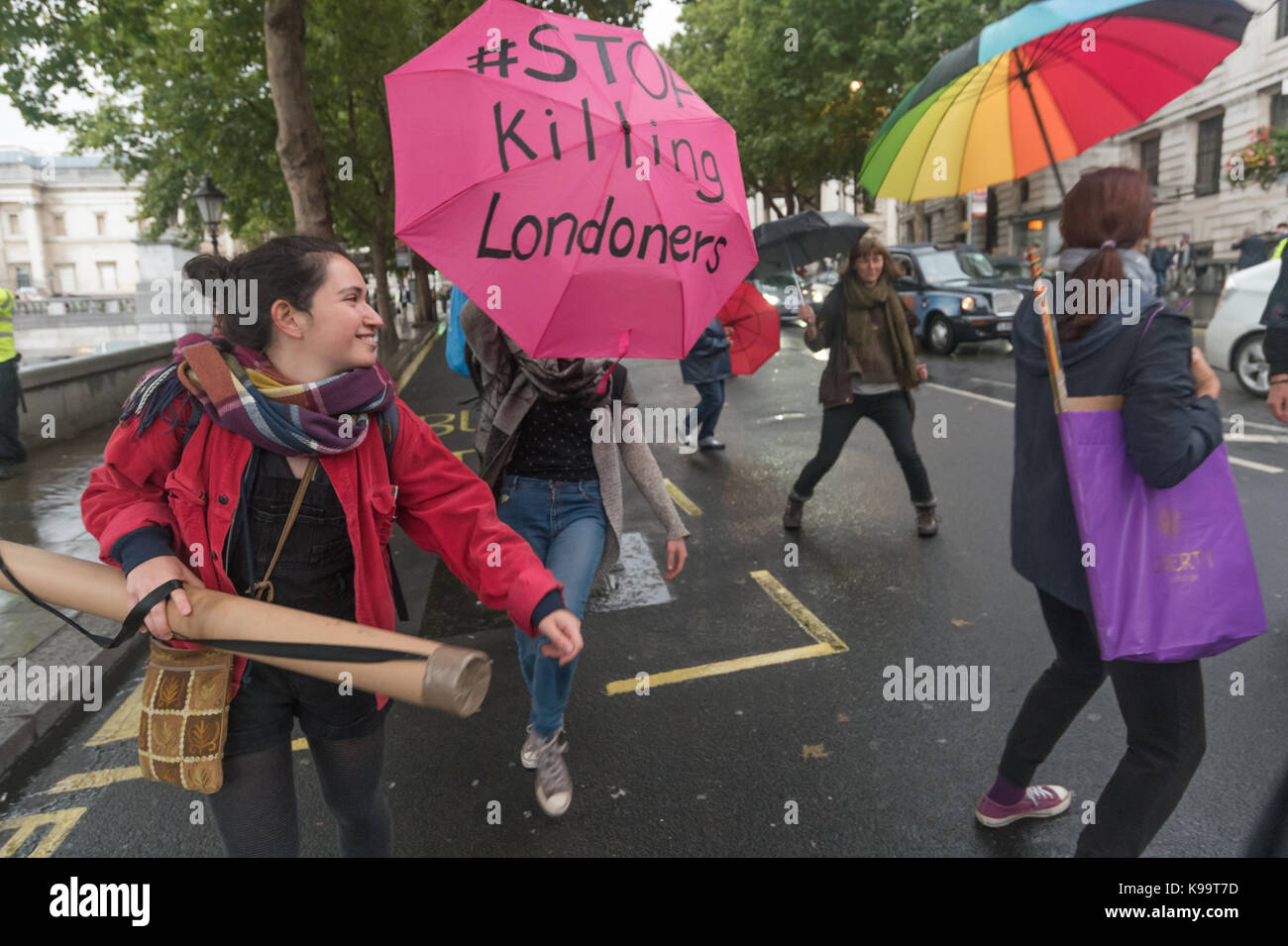 September 21, 2017 - London, UK - London, UK. 21st September 2017. After successfully blocking all traffic in Trafalgar Square for a short protest and a few minutes rest, 'Stop Killing Londoners' block the east side of the square for a few minutes of disco protest, dancing to loud music on the roadway. Eventually police came and told them to leave and the protest ended. This was the 5th protest by campaigners from Rising Up aimed at mobilising people across London to demand action from the Mayor and TfL who are failing to confront this pressing problem. Boris laughed at the problem and Sadiq K Stock Photo