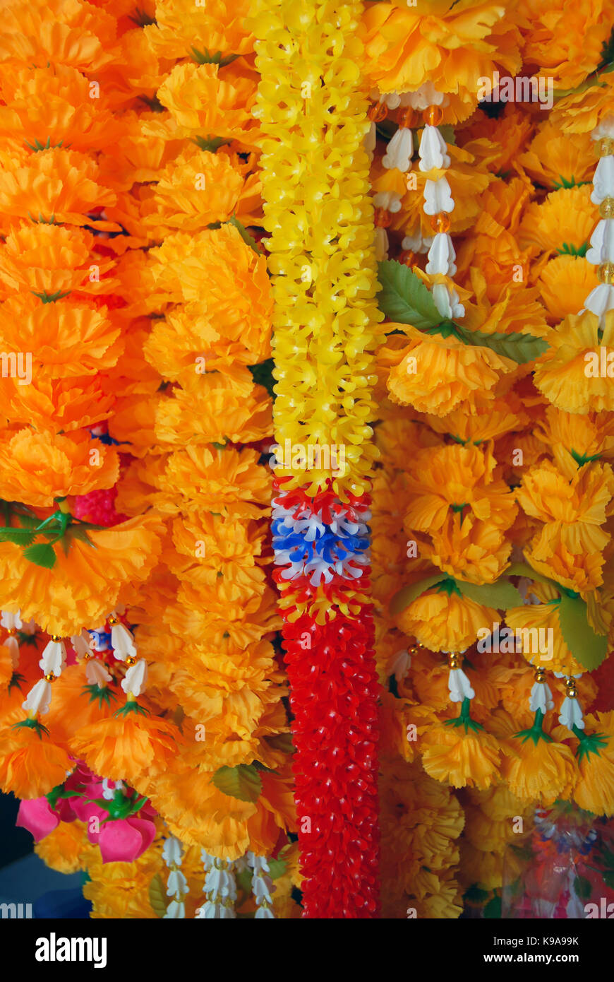 Marigold phuang malai, traditional Thai flower garland offerings at Wat