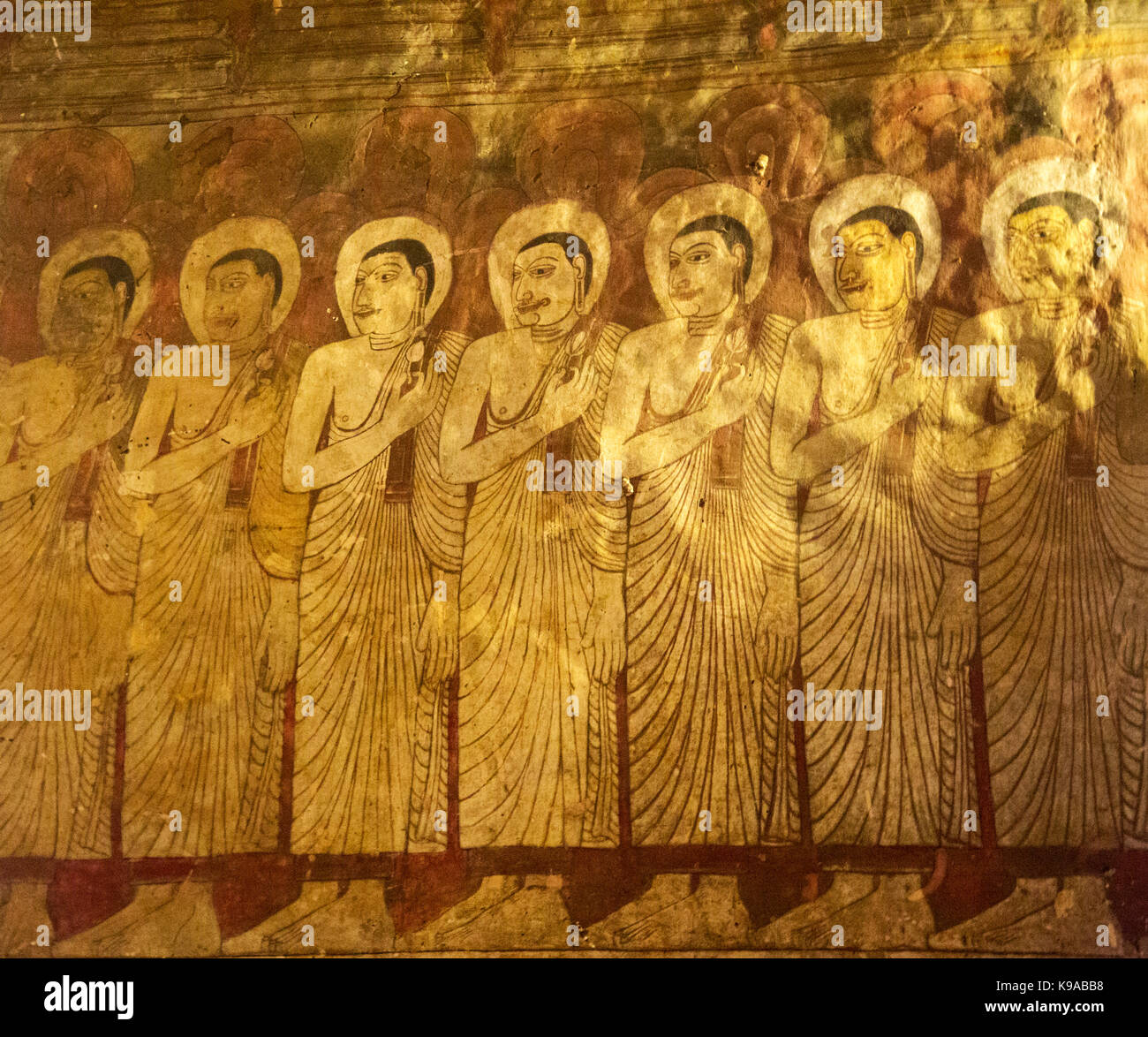 Dambulla Sri Lanka Dambulla Cave Temples - Cave II  Maharaja Viharaya Painting Of Row Of Arhat Bhikkus Holding A Flower Close To Chest As Offering To Buddha Stock Photo