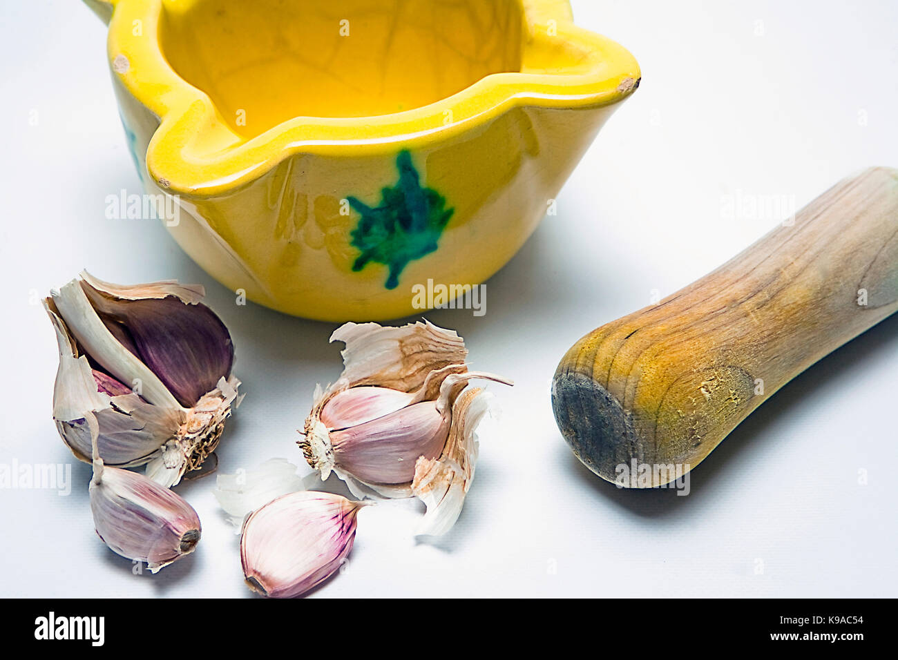 Ceramic mortar and garlic, used in the Spanish traditional kitchen, Spain Stock Photo