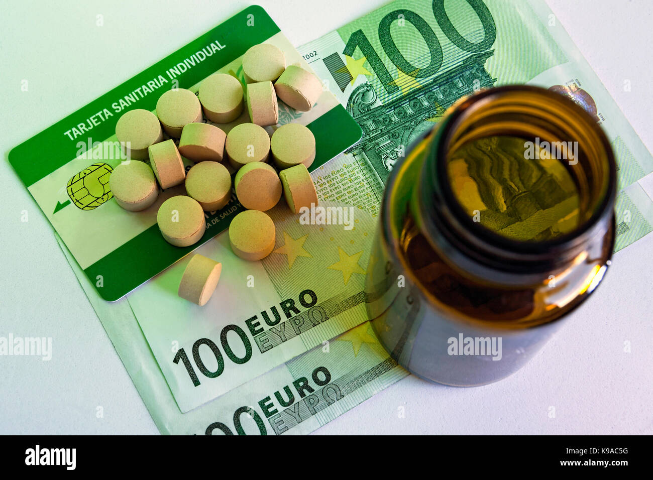 tablets and pill bottle, concept of pharmaceutical copayment Stock Photo