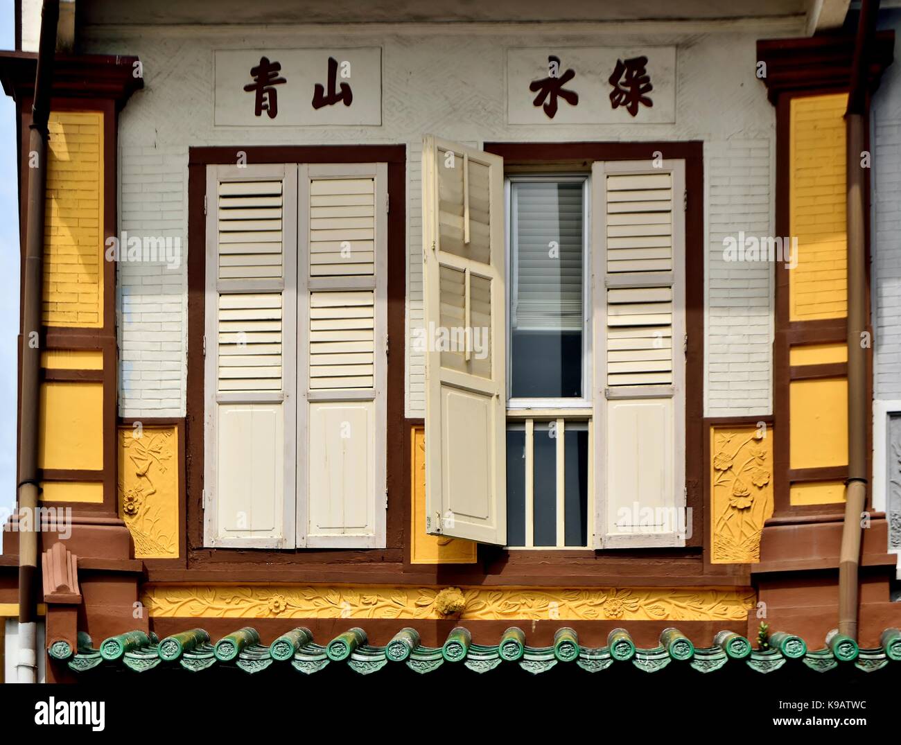 Traditional Singapore shop house exterior with wooden louvered shutters in the historic Duxton District. Stock Photo