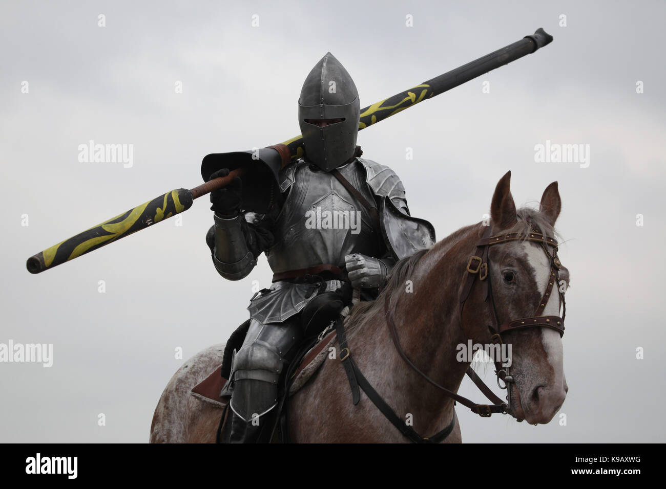 Czech actor Michal Bednář dressed as a medieval knight rides a horse during the filming of the new German film 'Die Ritter' ('The Knights') directed by Carsten Gutschmidt by order of ZDF in Milovice in Central Bohemia, Czech Republic in 23 October 2013. Stock Photo