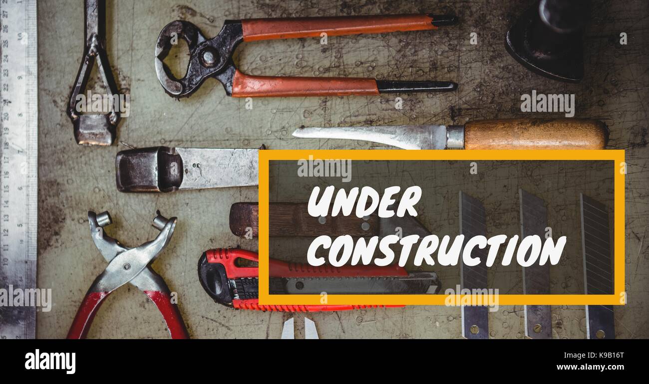 Digital composite of Under construction message on images of tools laid