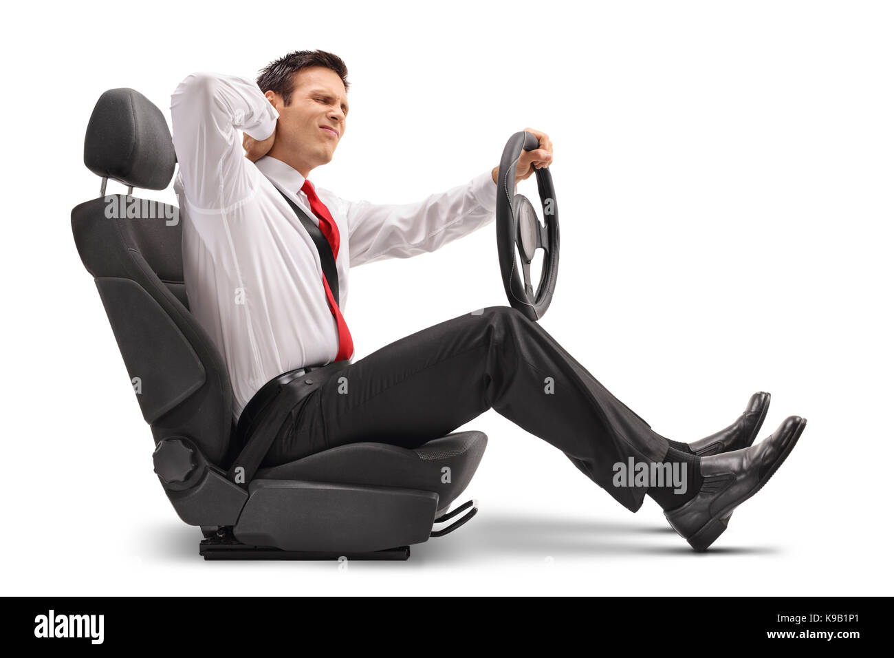 Elegant man seated in a car seat experiencing neck pain isolated on