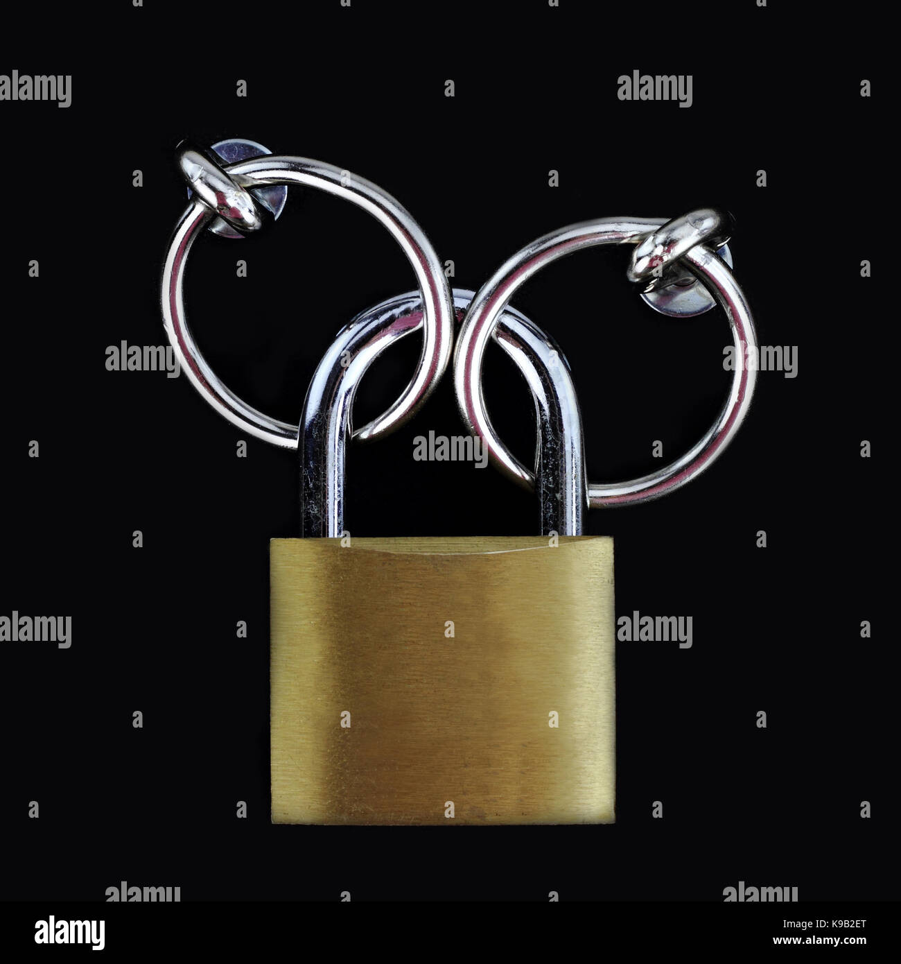 Closed padlock on black background Stock Photo - Alamy