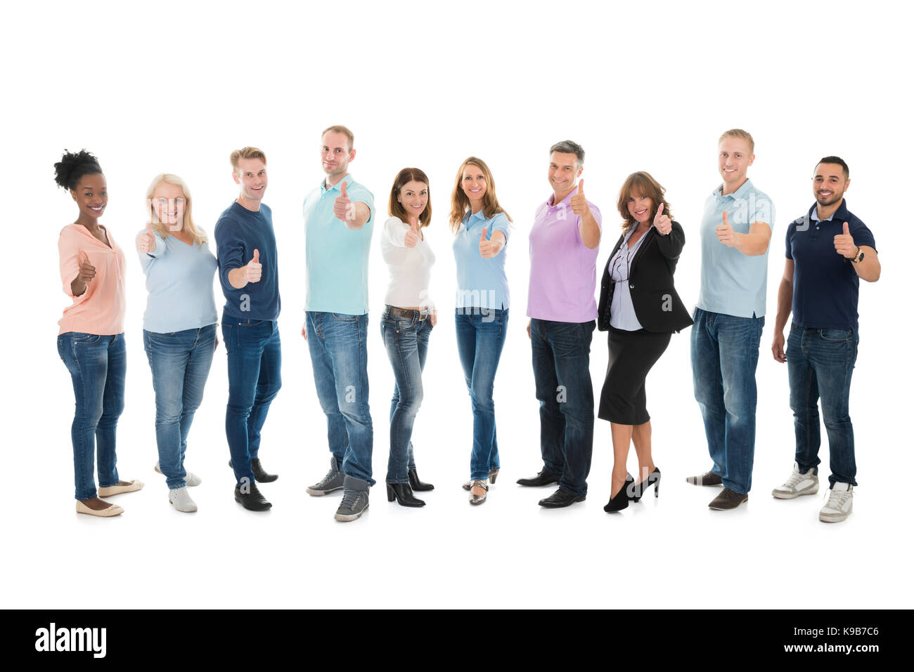 Full length portrait of creative business people standing together against white background Stock Photo