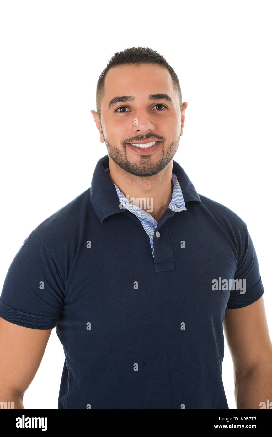 Portrait of happy young man in casuals standing against white background Stock Photo