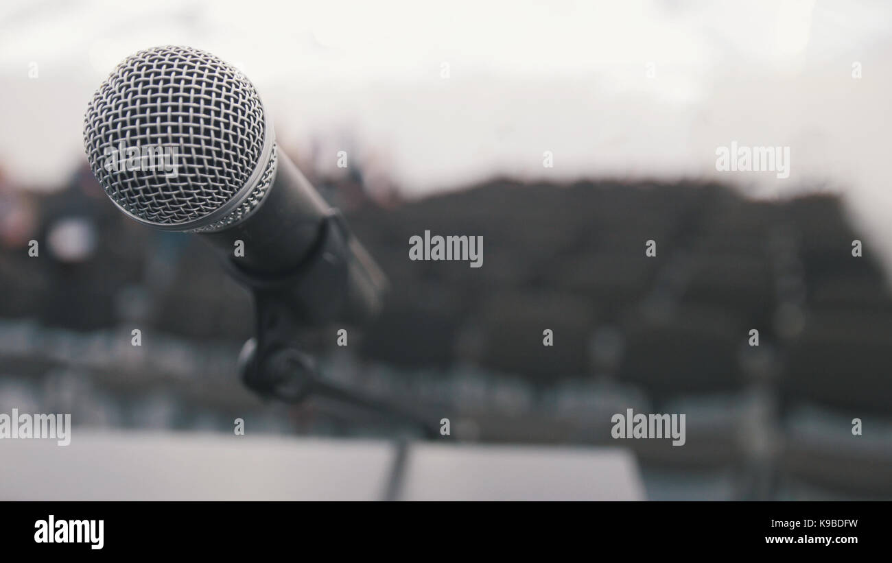 Conference of lecture microphone on stage in auditorium waiting for