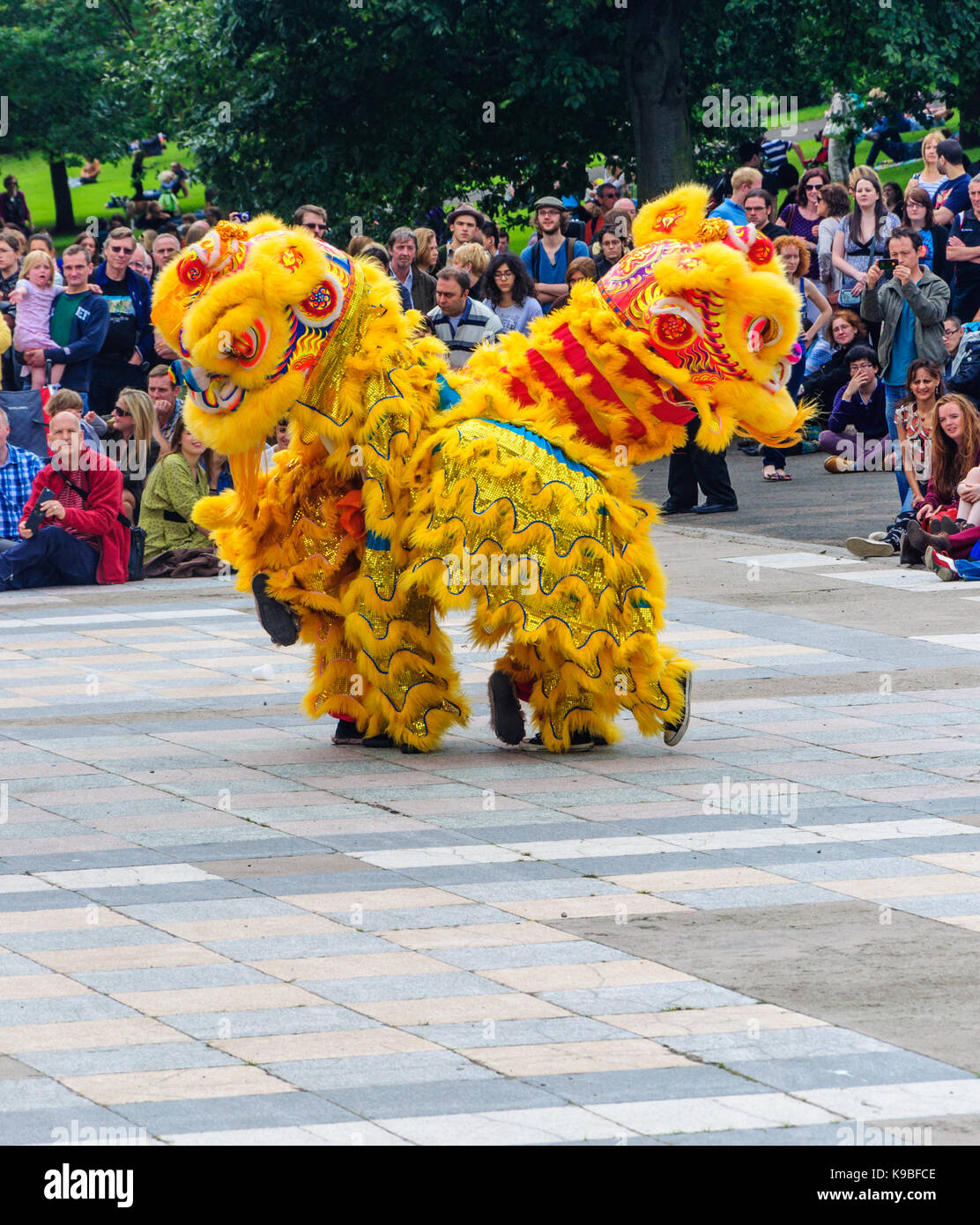 Performers from the Glasgow Hong Lok Dragon and Lion Dance Troupe during the Carnival of The Edinburgh Jazz and Blues Festival, Scotland, UK Stock Photo
