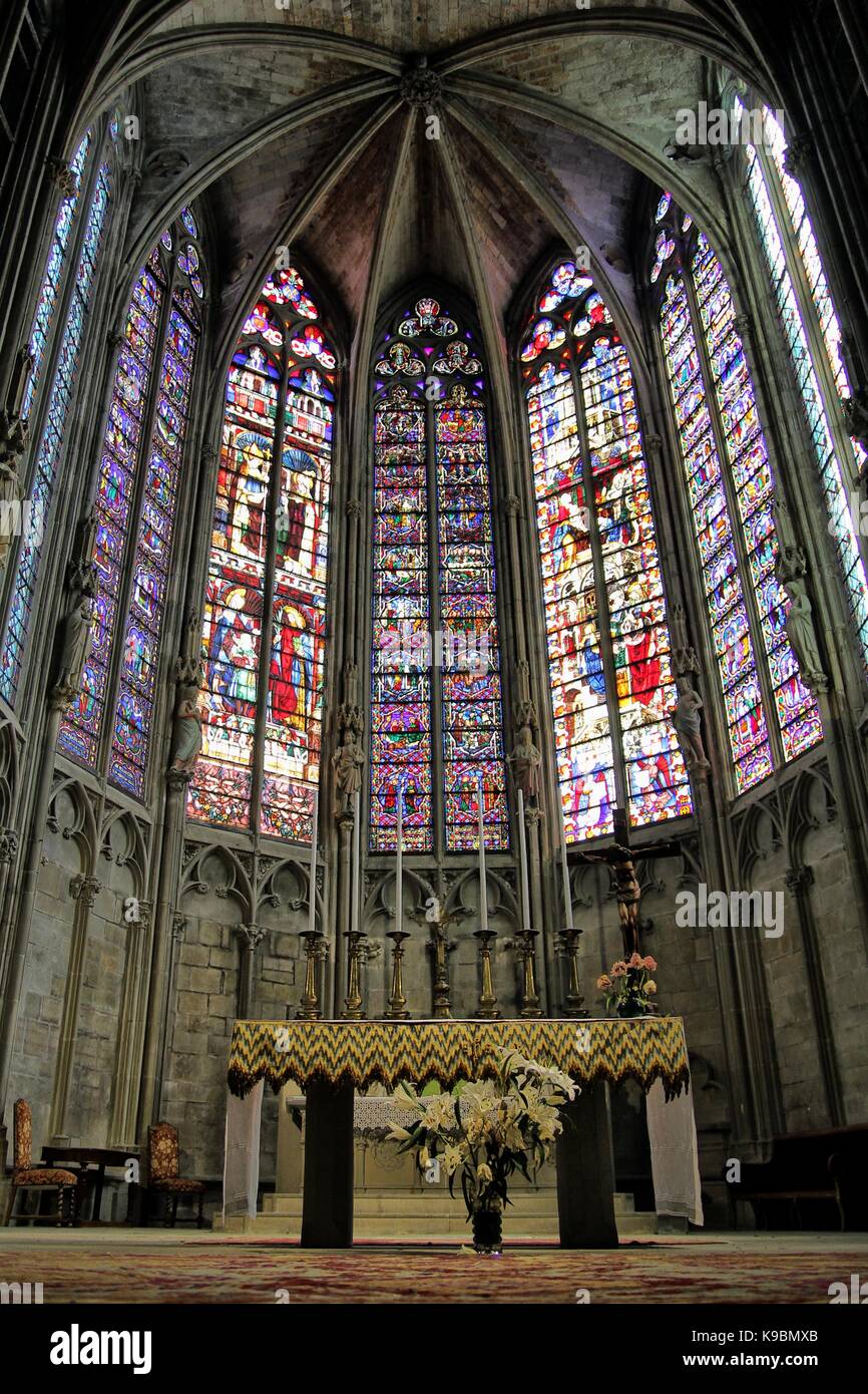 Altar and beautiful stained glass windows of The Basilique Saint Nazaire, in the medieval French fortified city of Carcassonne, La Cite, Languedoc-Rou Stock Photo