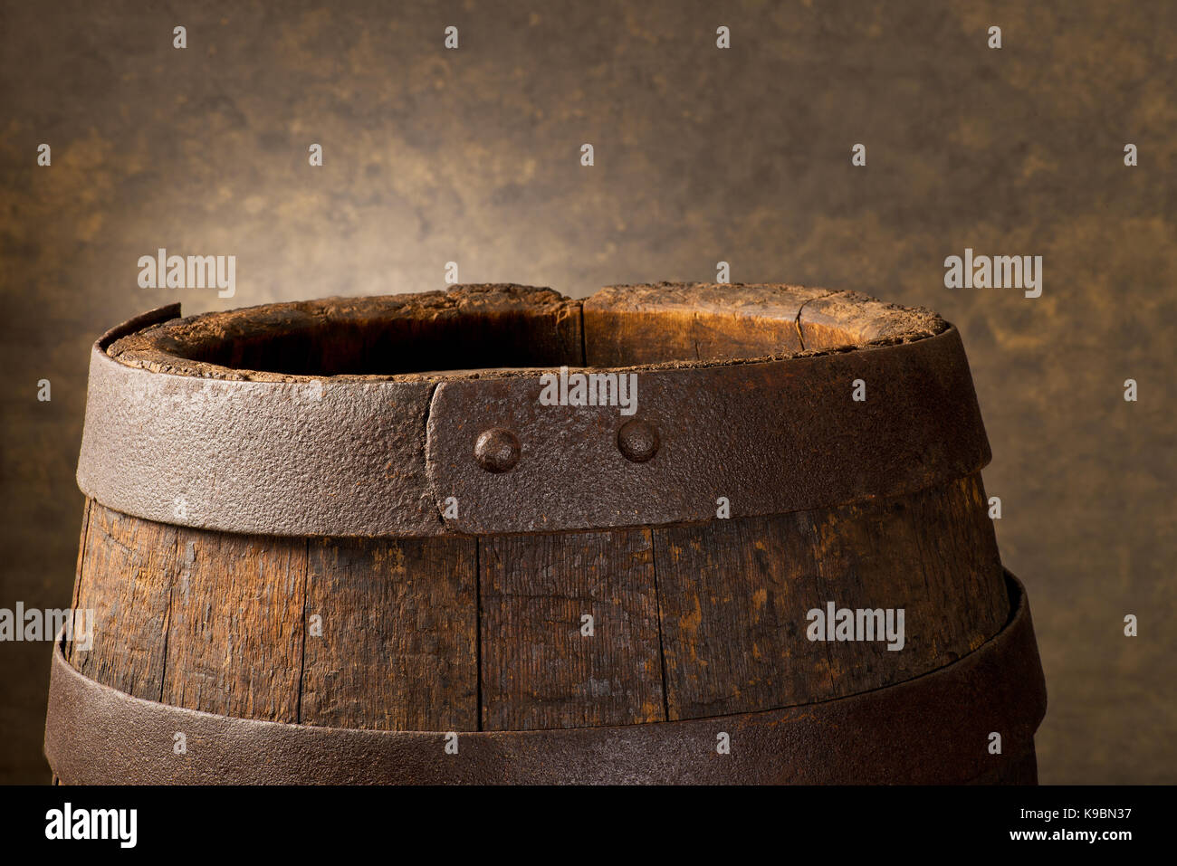 Old Wooden Beer Barrel on the Dark Background. Stock Photo