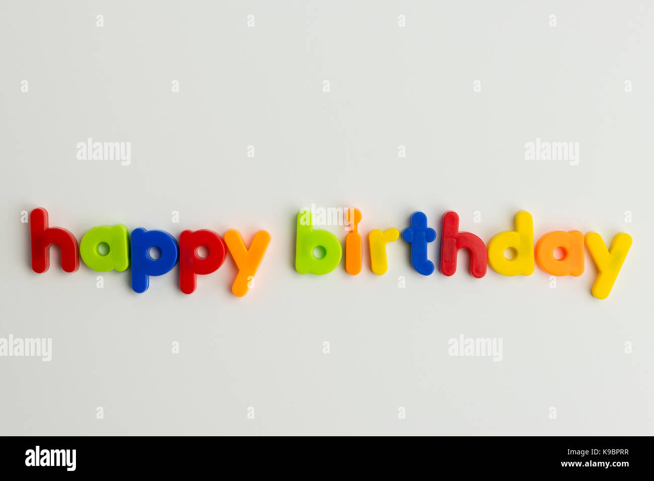 happy birthday words in colourful children's letters Stock Photo