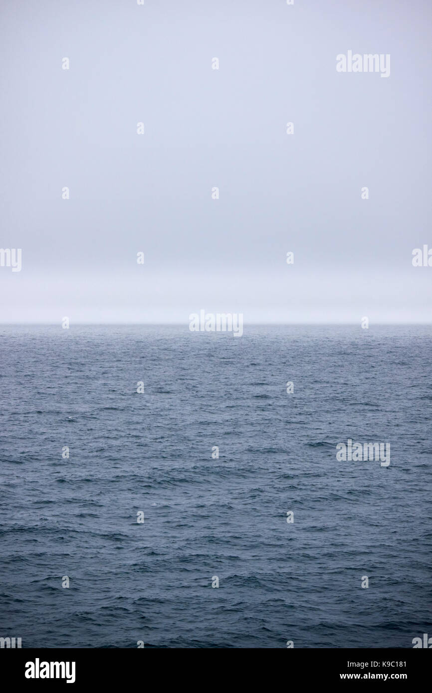 fog lifting at sea Stock Photo