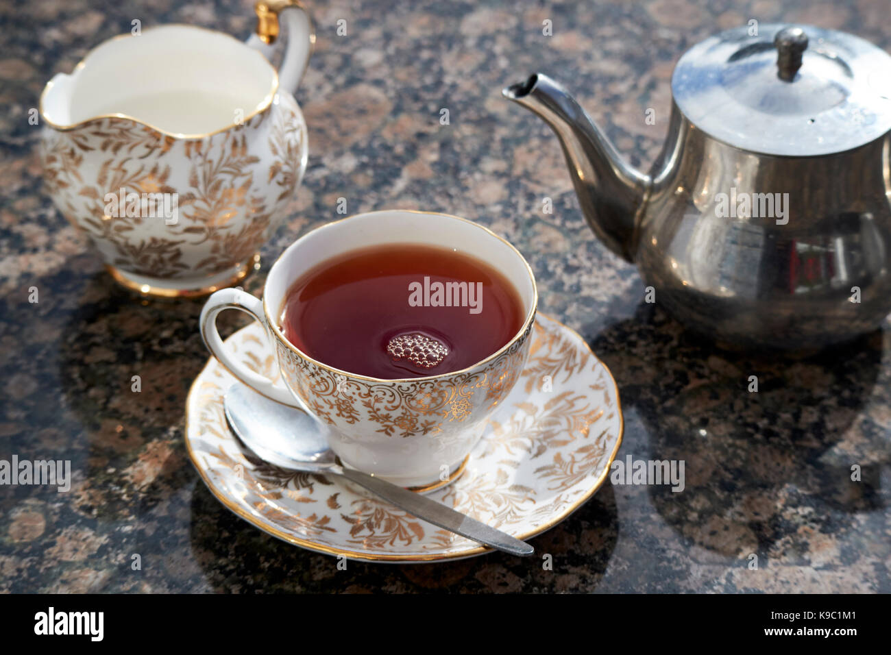 english cup of tea served in fine bone china cup and saucer Stock Photo
