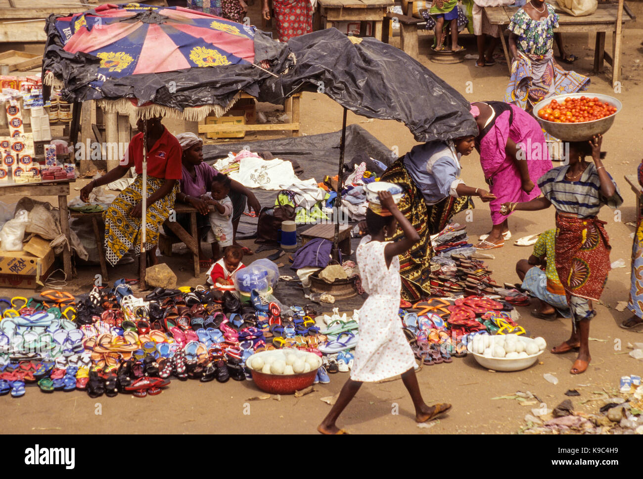 Bondoukou, Ivory Coast, Cote d'Ivoire. Market Scene Shoes, Sandals