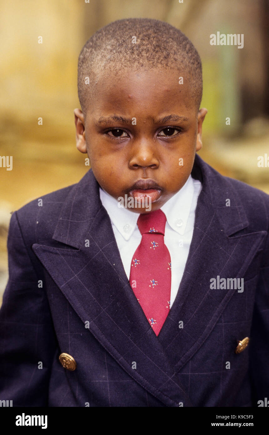 Abidjan, Ivory Coast, Cote d'Ivoire.  Little Ivorian Boy Dressed for his First Visit to Paris. Stock Photo