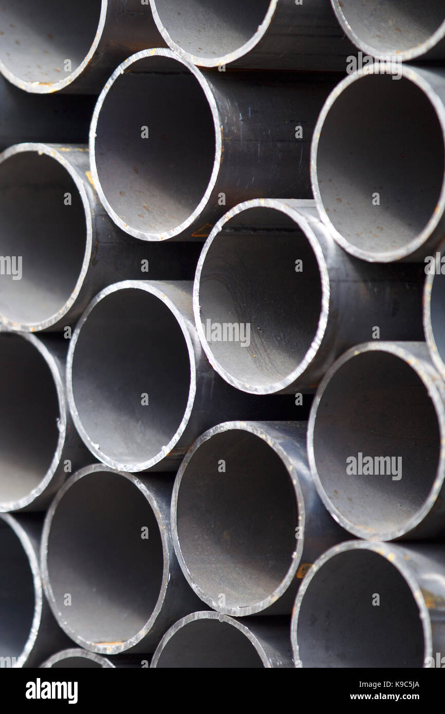 Metal profile pipe of round section in packs at the warehouse of metal ...