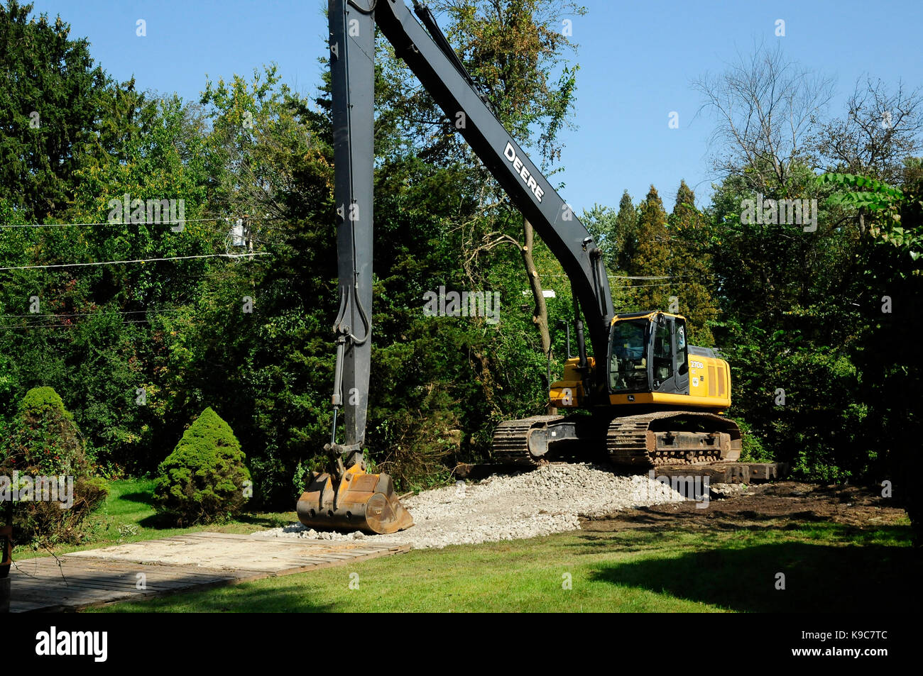 Dredging equipment clearing bottom silt out of river channel. Stock Photo