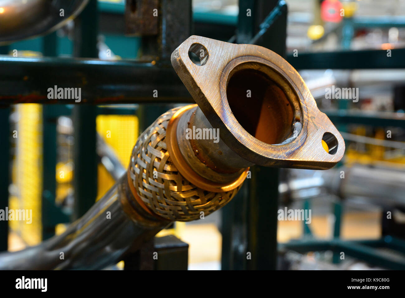 Exhaust pipes on the assembly line at Jaguar Land Rover, Lode Lane, Solihull, West Midlands,UK. Stock Photo