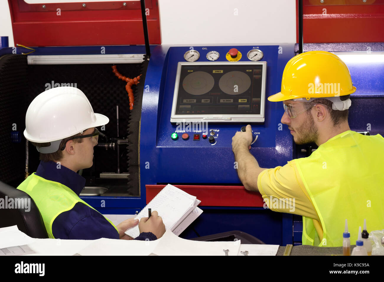 Machinists controls the operation of devices Stock Photo