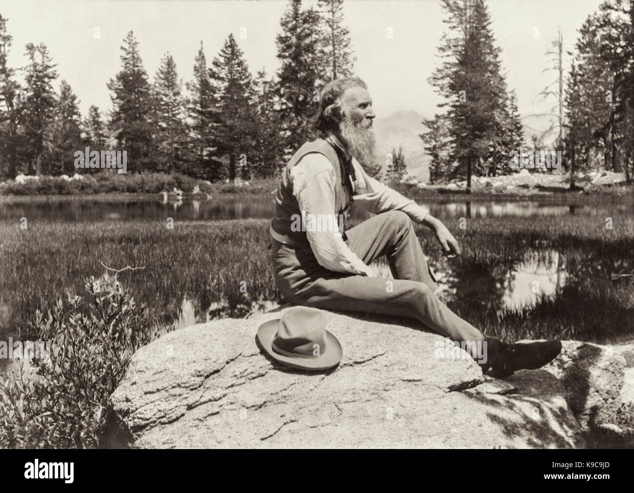 John Muir (1838-1914) naturalist whose passion for the preservation of wilderness areas in the United States conveyed through his writing helped establish Yosemite National Park and the US National Park Service. Photograph taken at Mirror Lake in Yosemite circa 1902. Stock Photo