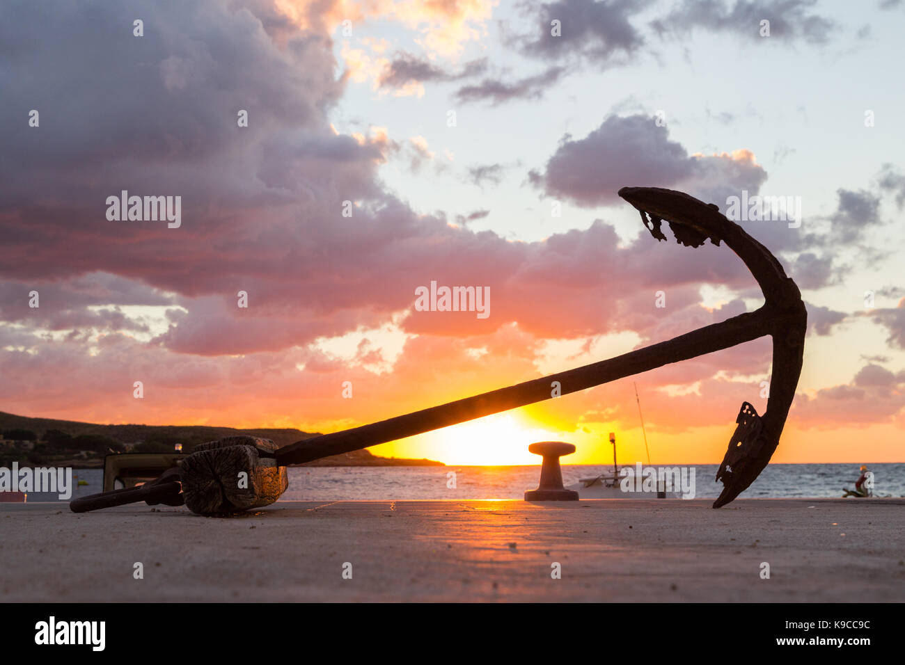 Sunset sea port row boat fishing sun Stock Photo