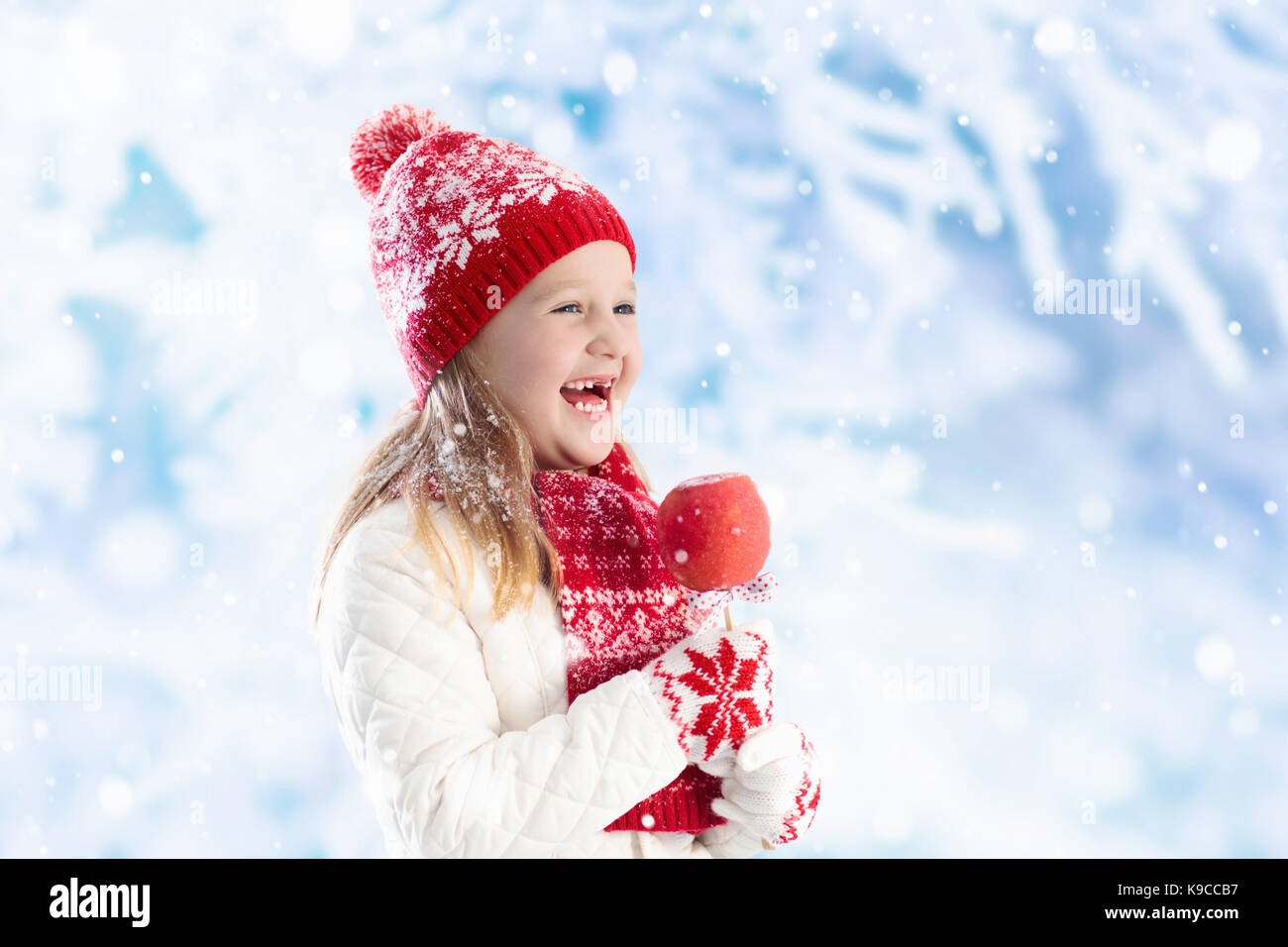 child eating candy apple on winter fair kids eat toffee apples on stock photo alamy https www alamy com stock image child eating candy apple on winter fair kids eat toffee apples on 160698363 html