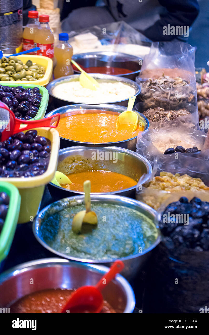 Salsas and olives on a market in Peru Stock Photo
