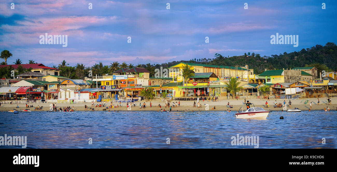 Panorama of White Beach from a boat on the Verde Island Passage at Puerto Galera, Oriental Mindoro, Philippines, Southeast Asia. Stock Photo
