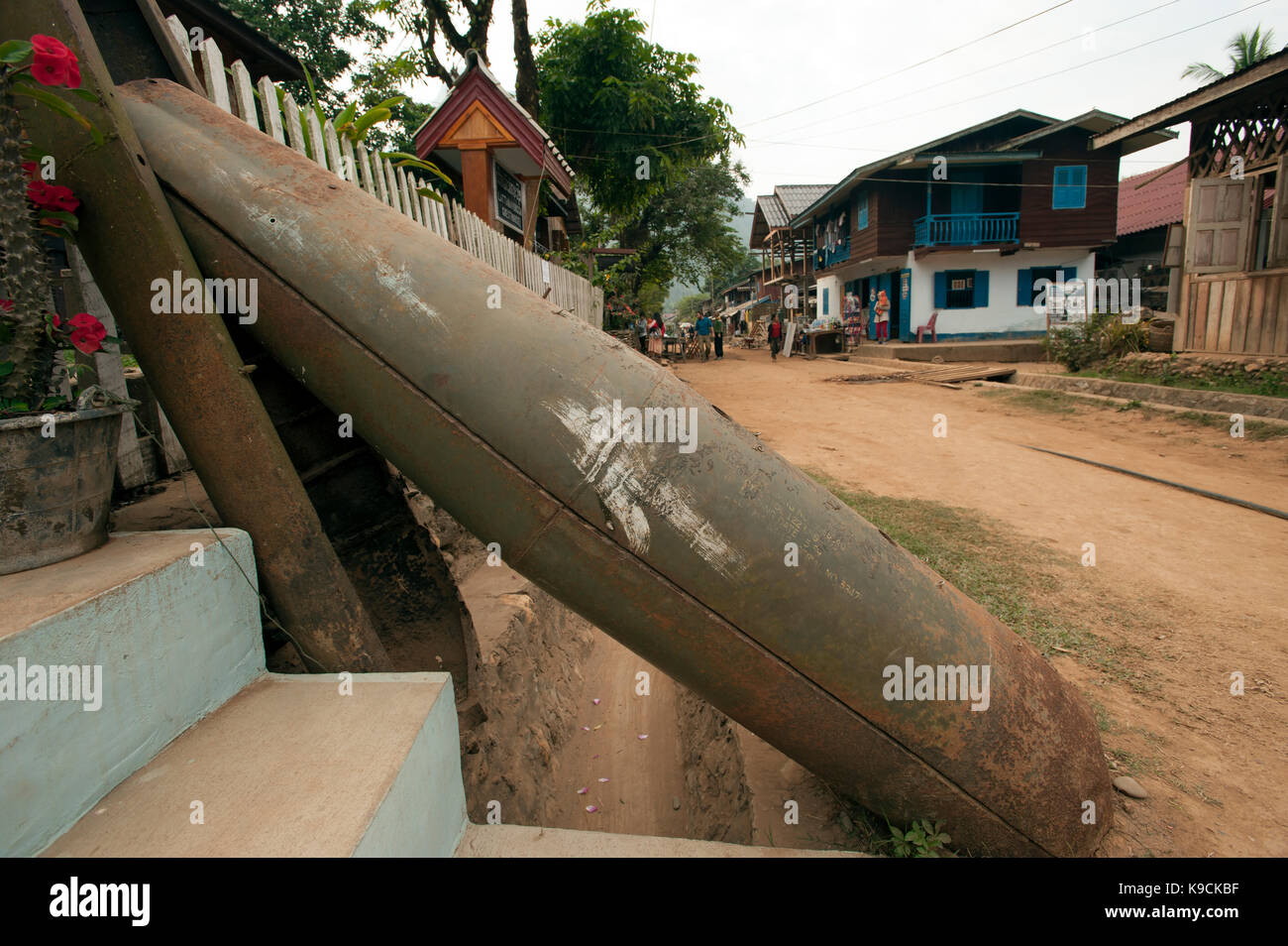 US Bomb casings left over from the Vietnam conflict used as a gate post to a guest house in Muang Ngoi Laos Stock Photo