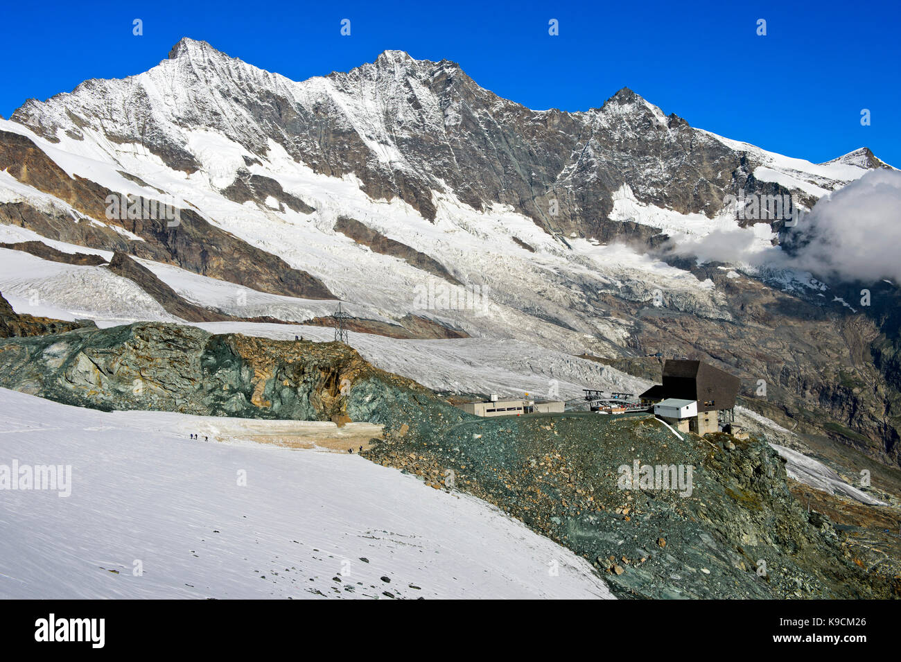 Cable car station Felskinn against the peaks of the Mischabel massif, Saas-Fee, Valais, Switzerland Stock Photo