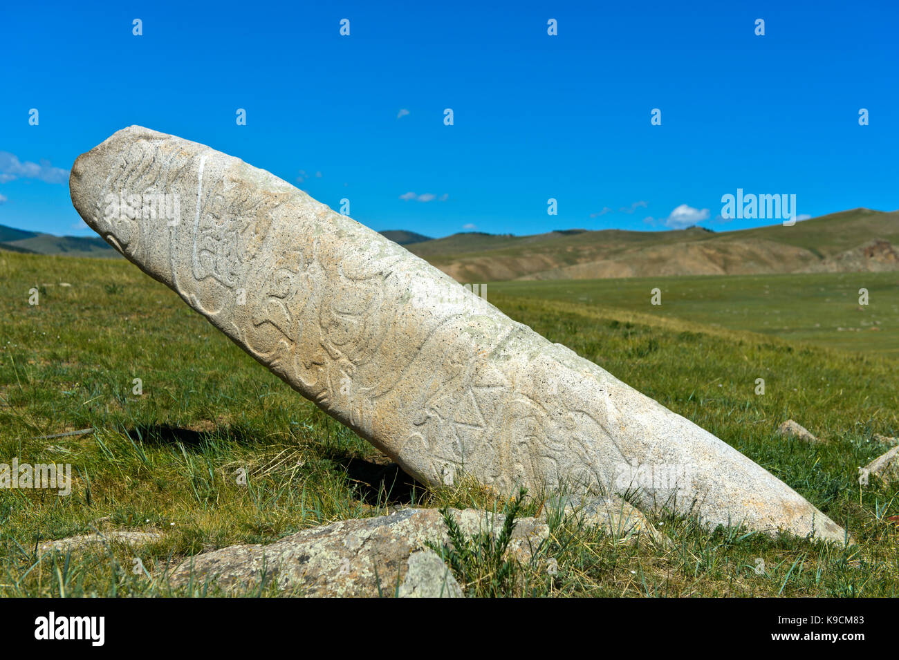 Megalith called deer stone decorated  of an ancient grave site from the Bronze Age, Khangai Nuruu National Park, Oevoerkhangai Aimag, Mongolia Stock Photo