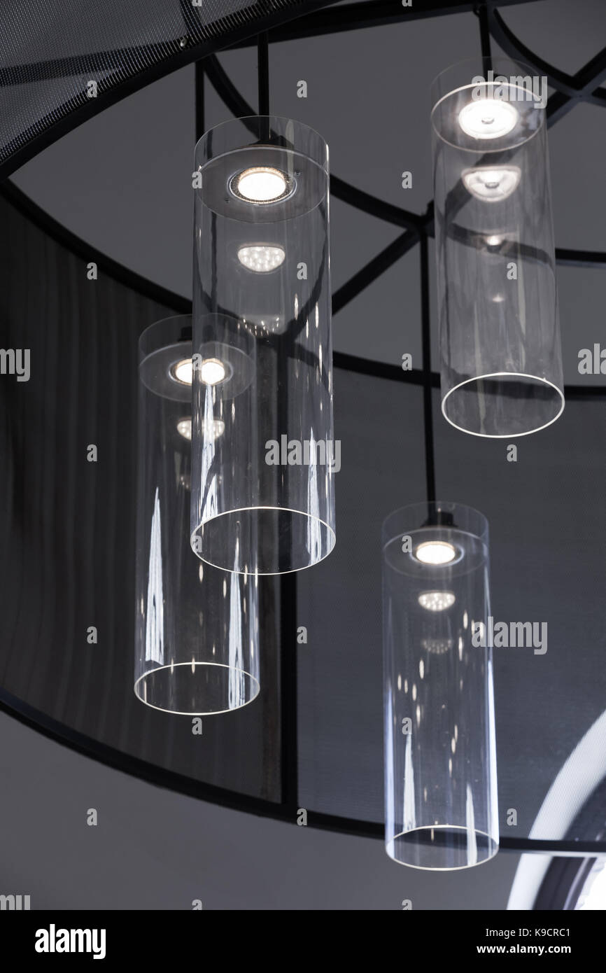 Modern interior design, vertical fragment, chandelier with round glass