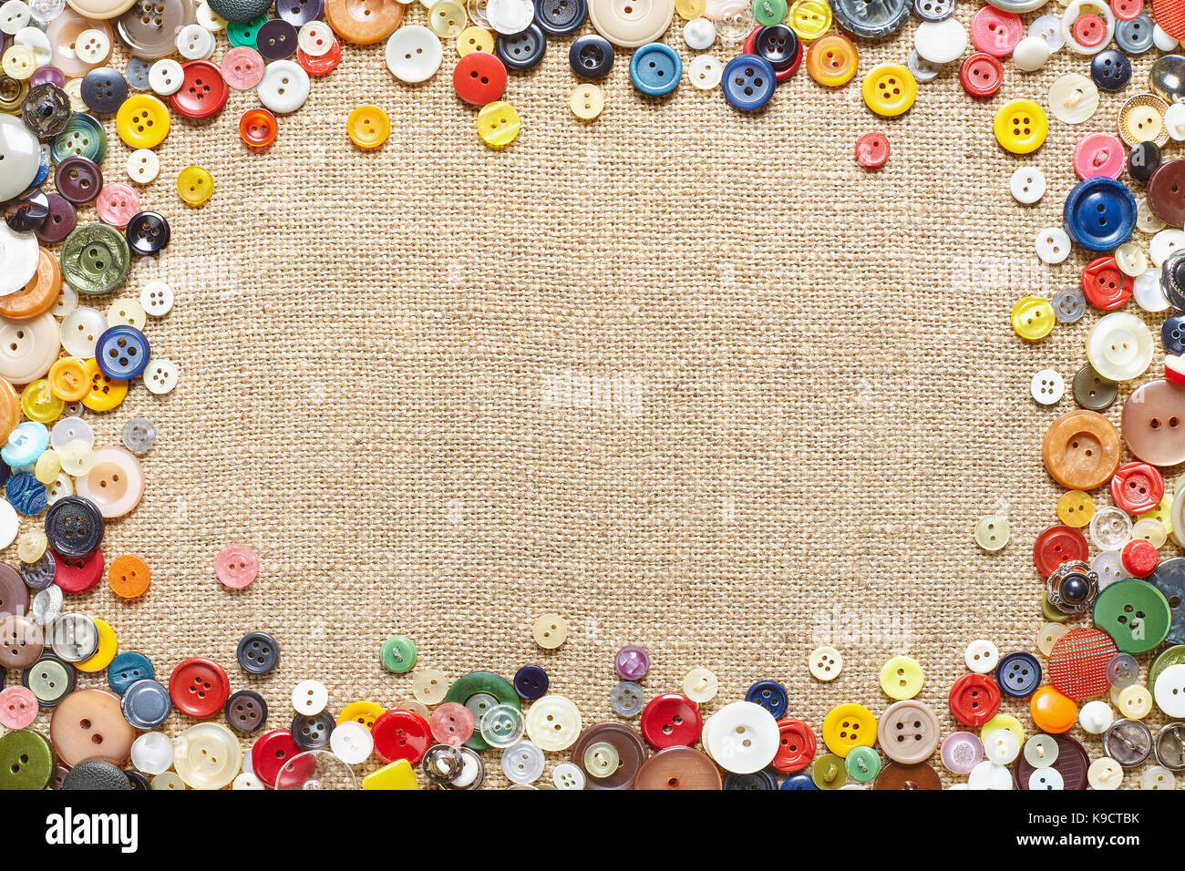 Buttons frame on fabric texture background Stock Photo - Alamy