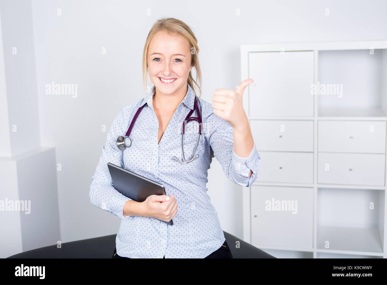 Medical doctor tablet thumb hi-res stock photography and images - Alamy