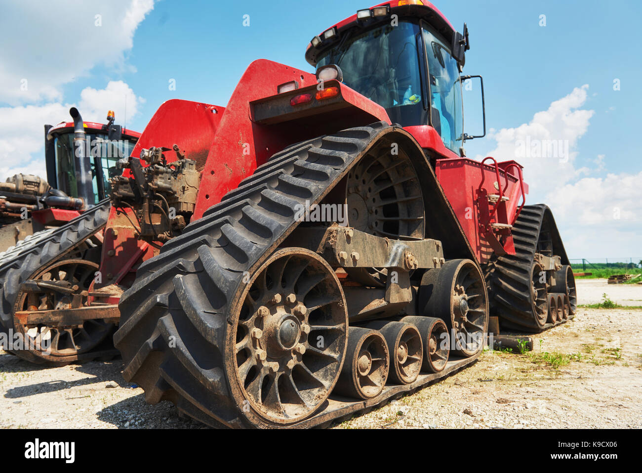 Harvesters and combine parts at the plant are waiting for sales, tractors and agricultural