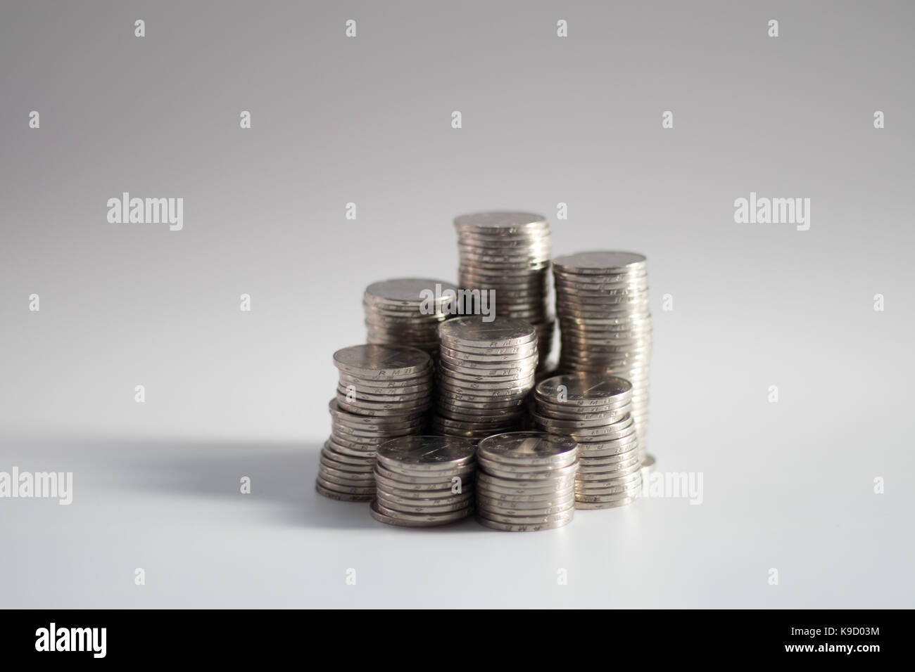 Stacks of coins of various heights symbolizing investments, savings
