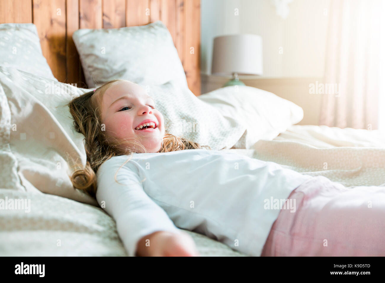 a girl lay on bed at home Stock Photo Alamy